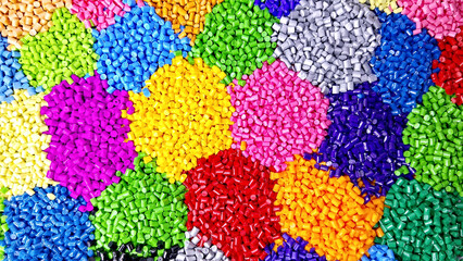 Obraz premium plastic masterbatch, colorful masterbatch granules as virgin polymer resin pigment, poured into white background media, suitable for industrial plastic company profile product catalog design