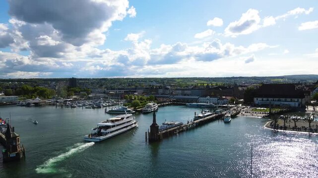 Passenger ship entering Konstanz harbor in sweeping aerial arc