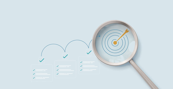 Magnifying glass focus on planning goals with digital checklist and target strategy, success achievement steps, corporate project management, performance tracking, and strategic growth objectives