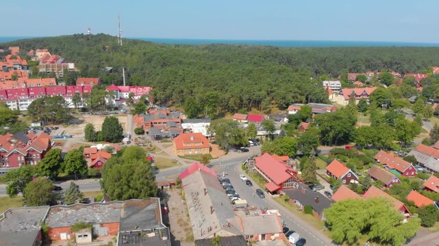 aerial footage showcasing the picturesque resort town of Nida, located on the Curonian Spit between the Curonian Lagoon and the Baltic Sea in Lithuania