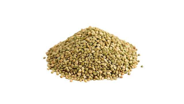 A loose pile heap of buckwheat raw green groats seasoning isolated on transparent background cut out