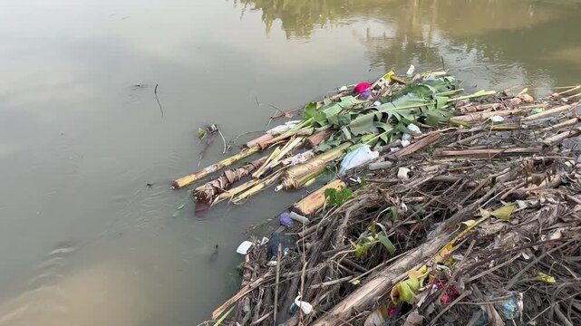 Plastic Waste and Organic Garbage Polluting River Water