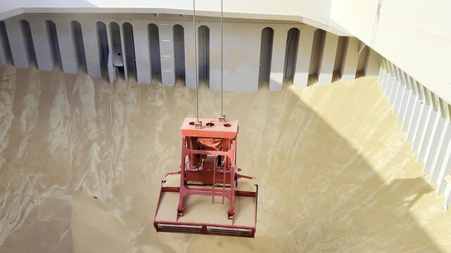 crane grab take wheat from ship cargo hold