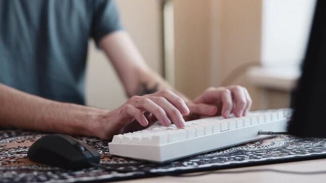 Focused Typing Session. Engaged In Concentrated Writing With Keyboard And Mouse In Personal Workspace. Media