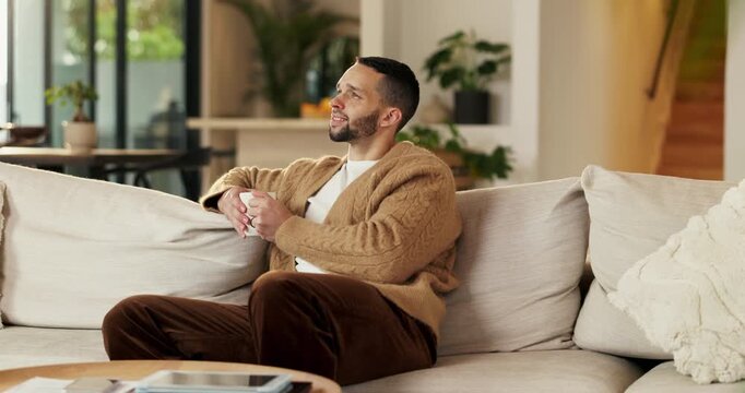 Thinking, happy and man with drink on sofa for reflection, memory and calm mindset in home. House, relax and person with beverage, tea and thoughtful for peace, inspiration and planning on weekend