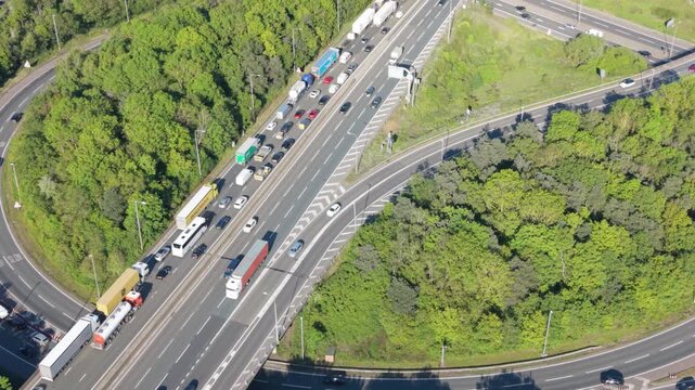 Aerial perspective of severe traffic congestion on a major highway interchange.