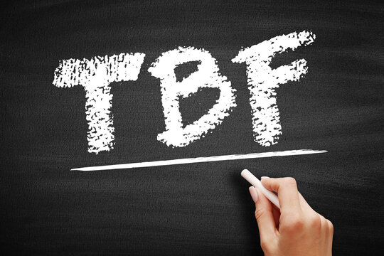 TBF text on a chalkboard, standing for To Be Fair. A hand holding chalk underlines the common acronym used in discussions and online comments to present an alternative or honest viewpoint