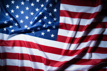 Fototapeta premium American flag waving fabric background with patriotic stars and stripes