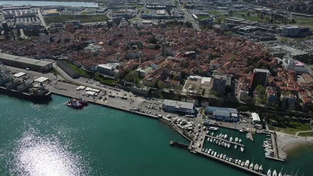 Lateral aerial sweep over Koper old town and harbor