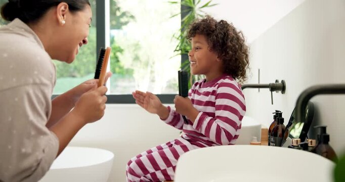 Mother, kid and singing with hairbrush in bathroom for grooming, fun morning routine and bonding. Happy, mom and child with haircare tool in home for karaoke, getting ready and dancing with self care