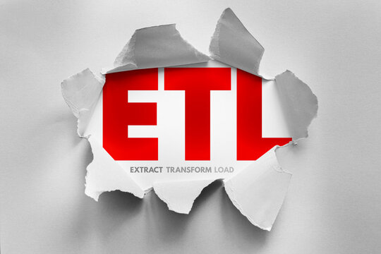ETL extract transform load concept revealed through torn paper design, data processing workflow illustrating integration, analytics preparation, database management and structured information pipeline