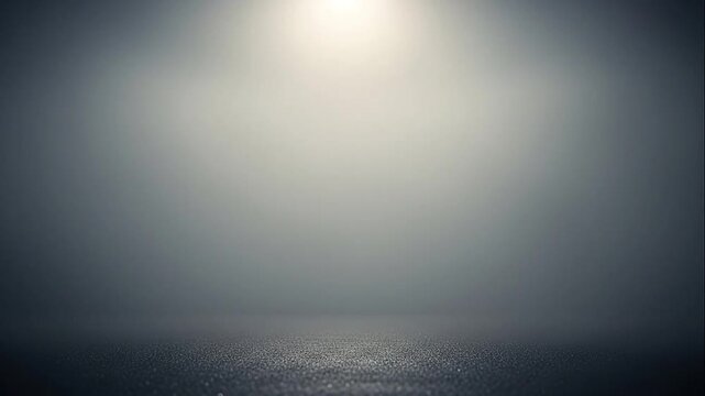 Bright light shining through dark foggy atmosphere.