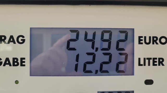 Rising fuel price on a gas station pump display