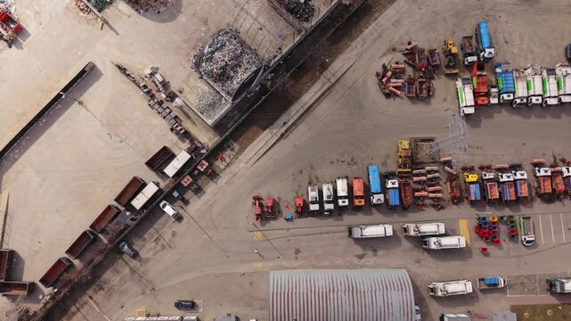 Parked Trucks Organized. Fleet In Warsaw Shows Systematic Organization And Color Coding. Parking Area Displays Carefully Organized Trucks With Clear Markings And Methodical Layout