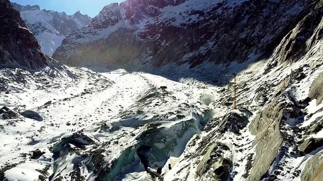 Sea of ​​Ice Glacier, aerial view. Glacial valley with ice and rocks. Panoramic view of the largest glacier in France. Chamonix-Mont Blanc. French Alps.