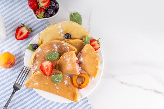 Pancake Dumpling, viral easy breakfast dessert recipe. Asian qatayef styled pancakes, Traditional american pancakes with fruit and berry fillings, made in form of dumplings