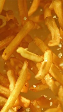 French fries fly up and fall down. Filmed on a high-speed camera at 1000 fps. High quality FullHD footage