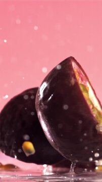 Fresh tropical passion fruit falls on a wet table. Filmed on a high-speed camera at 1000 fps. High quality FullHD footage