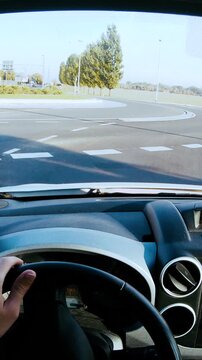 Person POV driving in roundabout slow motion