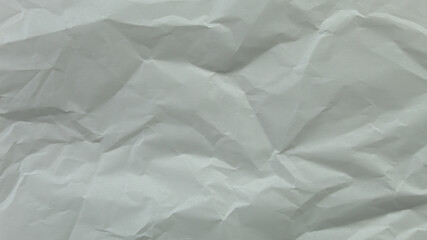 Fototapeta premium White wrinkled paper texture with soft folds, clean minimal background