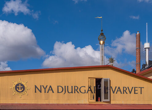 Shipyard facade with nya djurg&aring;rdsvarvet sign under blue sky