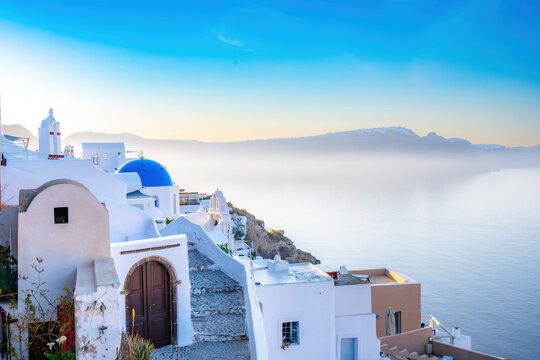 Soft blue mist over Oia and the caldera