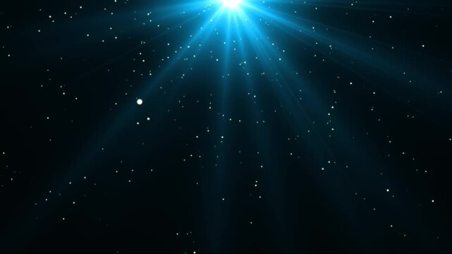 Abstract blue glitter stars flying with shimmering light flare, luxury holiday bokeh particles, sparkling dust rays and festive christmas new year social media motion background design 4K