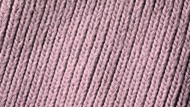 Pink knitted fabric texture macro background, soft textile pattern and cozy material concept.