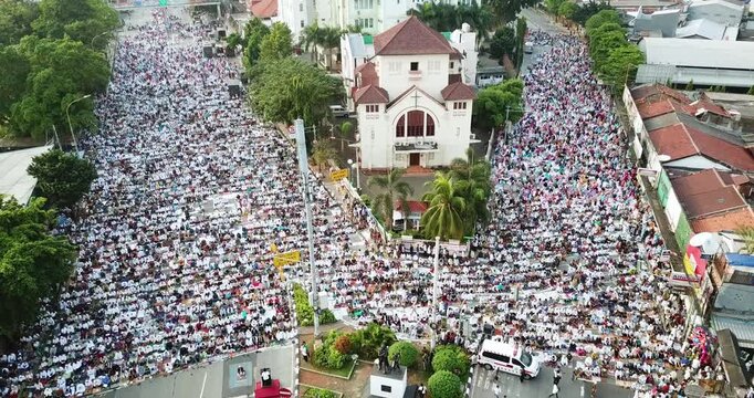Massive Crowd of Muslim Worshippers Praying on City Streets for Eid al-Fitr Aerial View