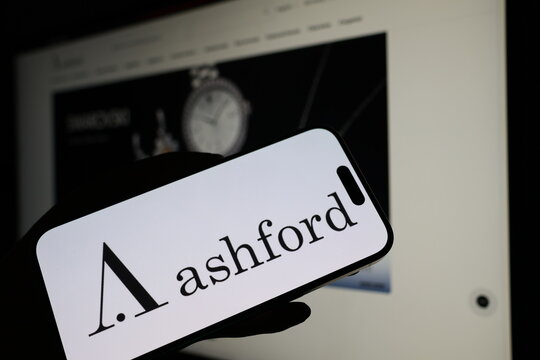 Kiel, Germany - 05-20-2026: Smartphone displaying US luxury watch retail company Ashford logo in front of companys webpage