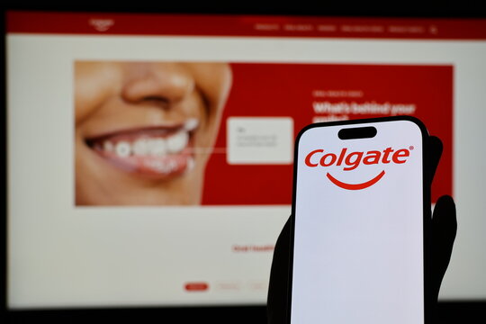 Kiel, Germany - 05-20-2026: Smartphone displaying US oral care company Colgate logo in front of companys webpage