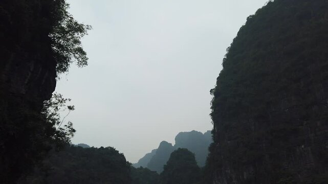 River between limestone mountains Ninh Binh Vietnam