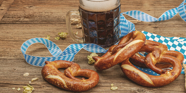 Traditional Oktoberfest set. Pretzels and beer, German festival food concept. Trendy hard light