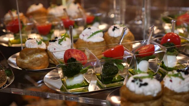 buffet for the holiday. beautifully decorated banquet table with appetizers canapes.