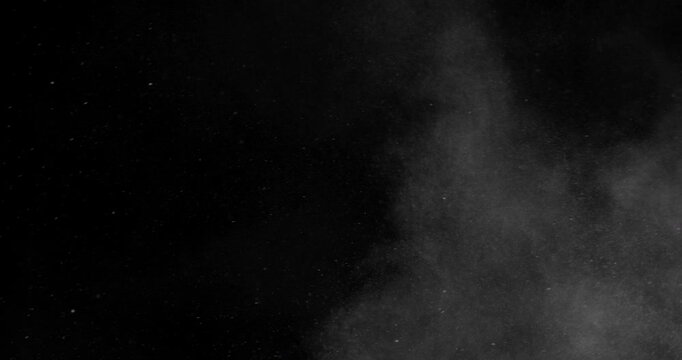 Super slow motion sandstorm and dust blizzard effect with airborne sand and fine particles, filmed at 500 fps on a high-speed camera. Isolated on black background, ideal as realistic VFX overlay.