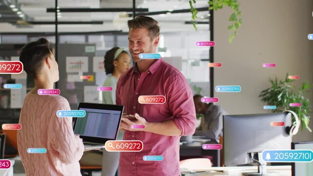 Mid adult woman presenting laptop spreadsheet to man in business office, HUD labels overlaying pair