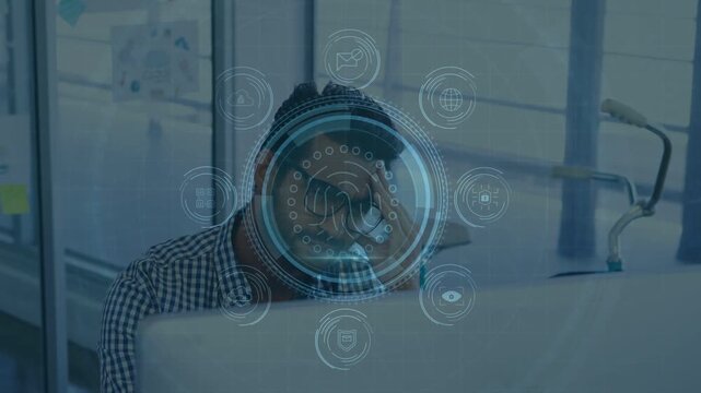 IT pro sitting behind monitor reacting to on-screen data protection alert, studying fingerprint HUD