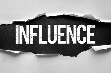 Naklejka premium Word INFLUENCE displayed in bold, grunge style text revealed beneath torn paper, conveying power, control, or social reach in a modern, impactful, and textured conceptual design