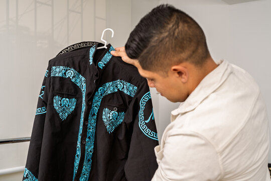 Mariachi artist preparing traditional charro uniform