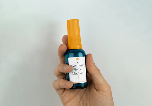 Small Spray Bottle in Hand Mockup