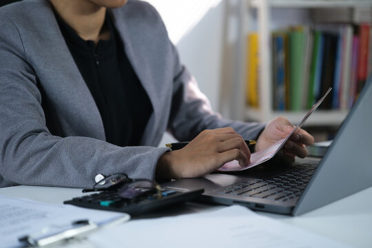 Viewing Bank Account Book in front of laptop, Account Statement, Money Number, Check Payment and Income, Financial Documents, Pay Slip, Cash Balance, Investment, Paper Page, Business
