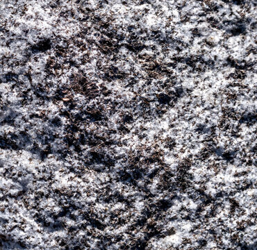 Texture background of crushed granite stones railway ballast close up