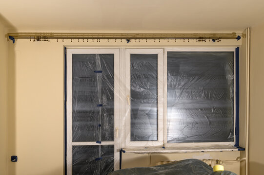 Renovation waste, renovation services, apartment covered with paint foil for painting