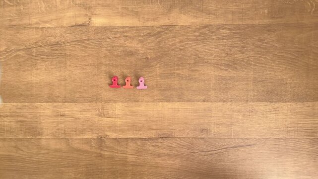 Child's Hand Removing a Yellow Binder Clip from a Row, 4K Slow Motion