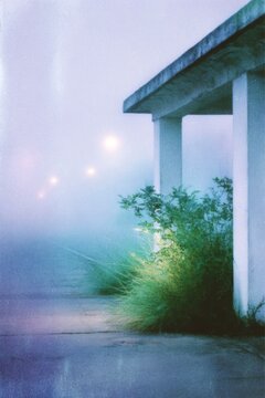 an old train station at dawn, with green and yellow tones
