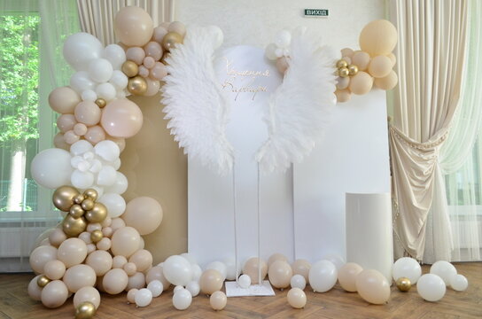 Children's photo zone with wings for a child's baptism
