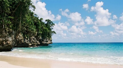 Fototapeta premium Tropical beach with rocky cliff and turquoise water