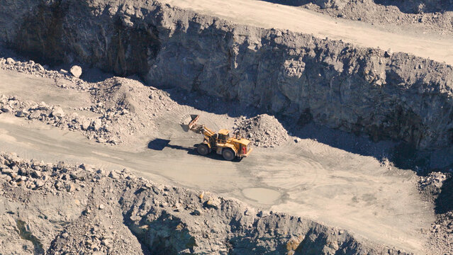 Aerial View of a Yellow Wheel Loader Working in a Quarry