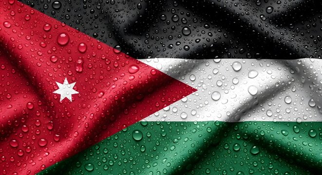 Close-up of the flag of Jordan with water droplets, showing the black, white, green, and red stripes with a white seven-pointed star on the red triangle.