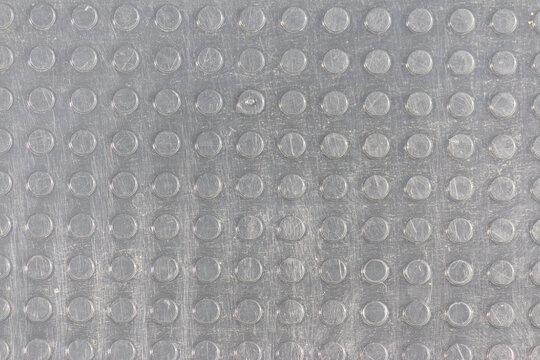 Scratched Transparent Plastic Texture with Raised Dot Pattern Full Frame Background